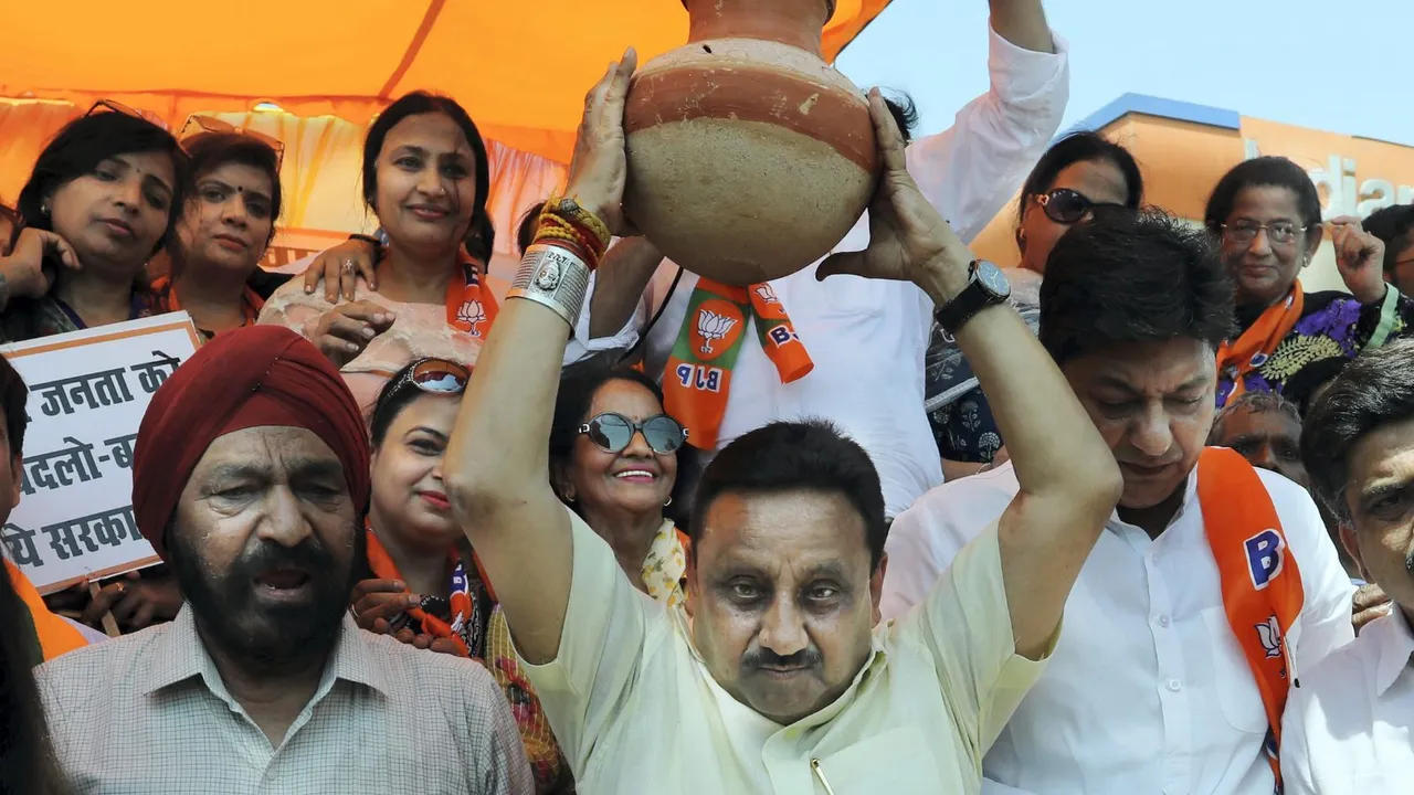 BJP MP Praveen Khandelwal with party workers during a protest against Delhi Government over the ongoing water crisis, at Model Town in Delhi, Monday, June 17, 2024.