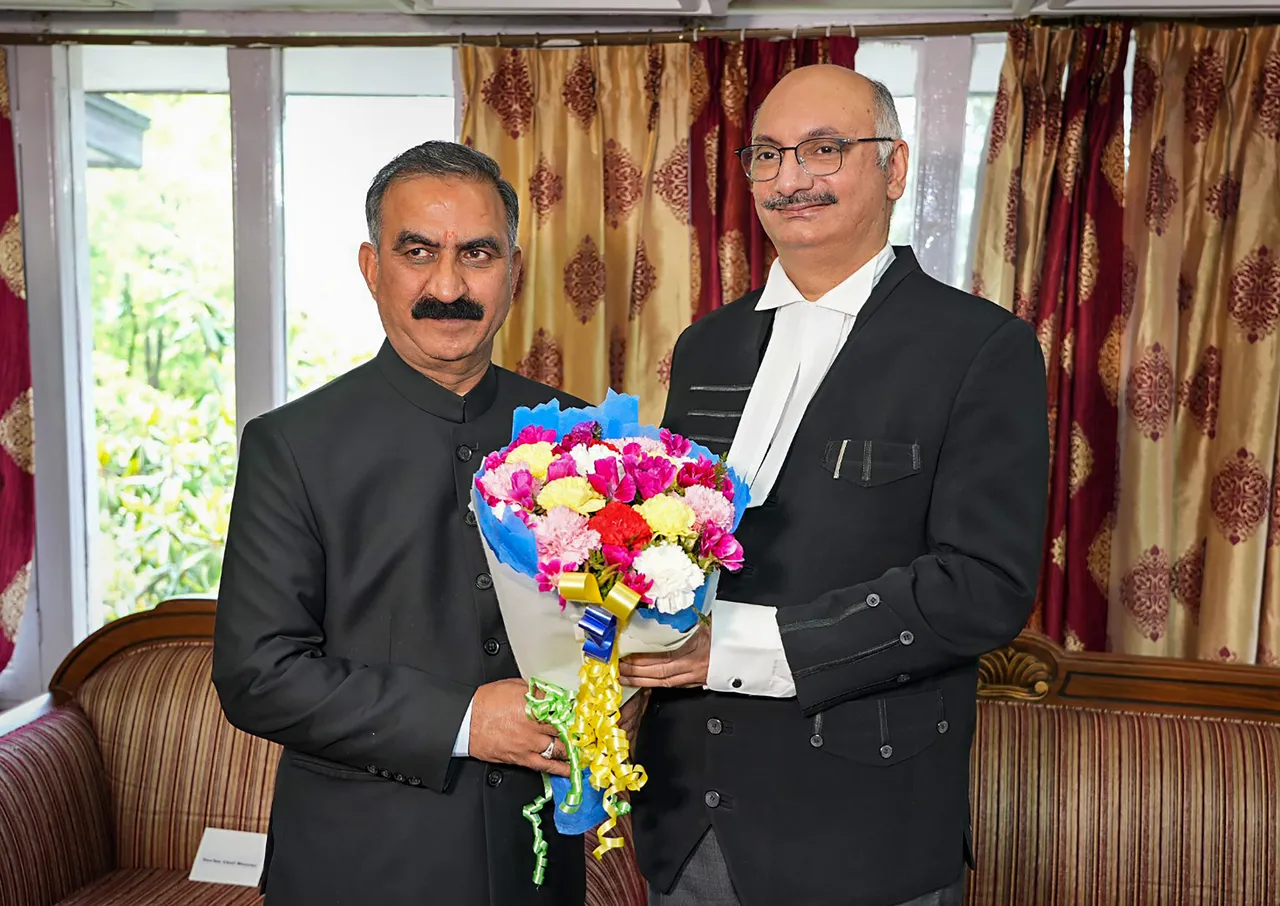 Himachal Pradesh Chief Minister Sukhvinder Singh Sukhu greets Justice M.S. Ramachandra Rao after the latter took oath as Chief Justice of Himachal Pradesh High Court