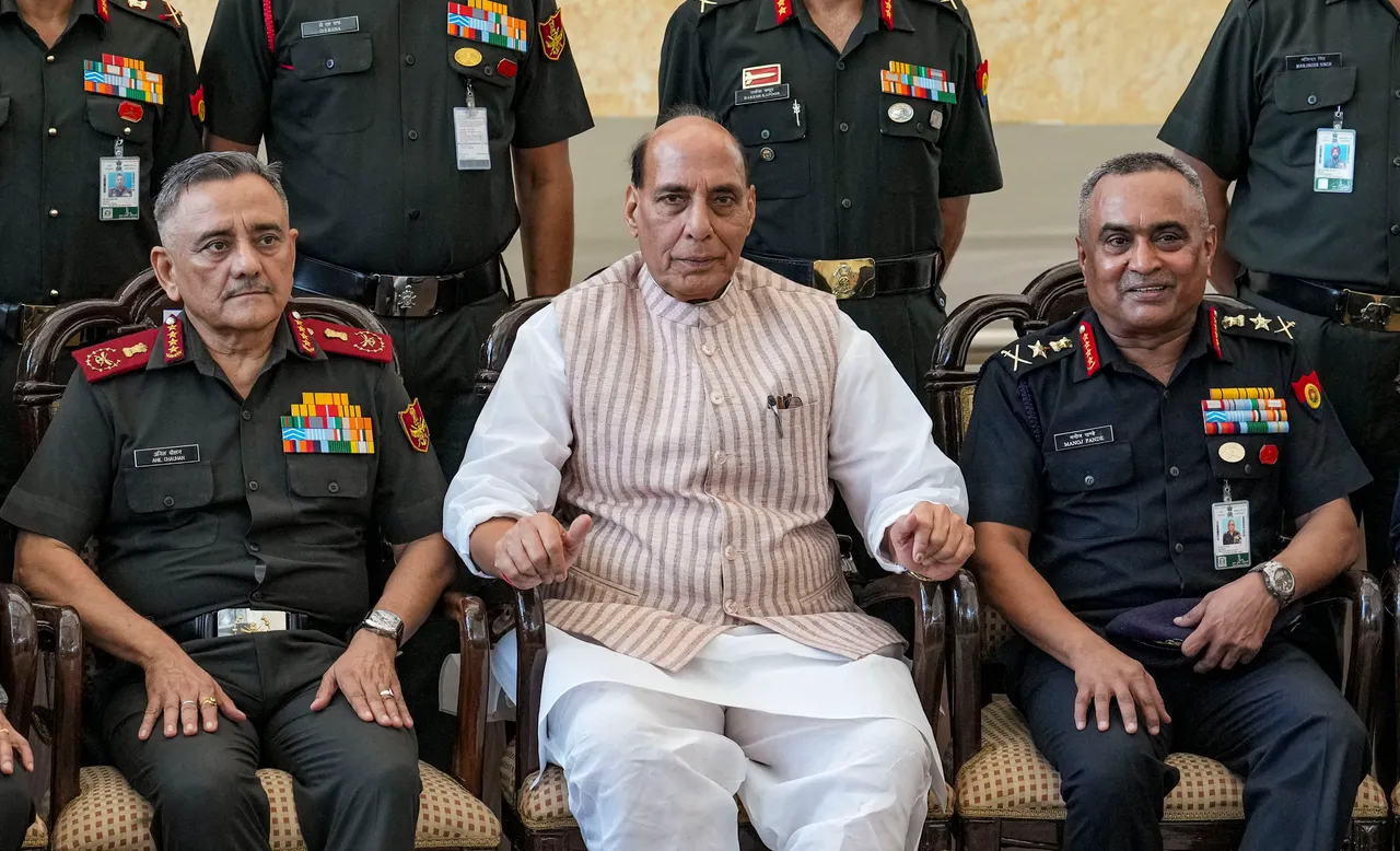 Defence Minister Rajnath Singh flanked by Chief of Army Staff General Manoj Pande, right, and Chief of Defence Staff of the Indian Armed Forces Anil Chauhan at the 75th anniversary event of ‘UN Peacekeepers Day’, in New Delhi