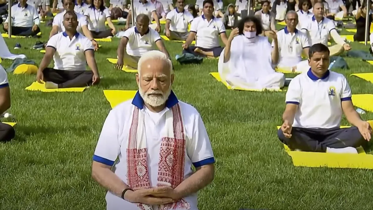 Prime Minister Narendra Modi performs yoga with others during the 9th International Day of Yoga celebrations at the UN headquarters, in New York, Wednesday, June 21, 2023