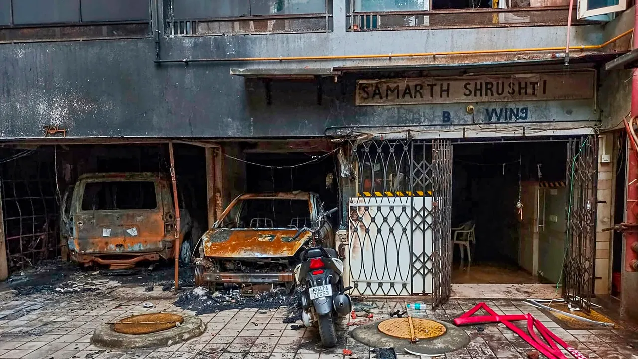 Charred vehicles after a fire broke out in a multi-storey residential building in Goregaon area Mumbai