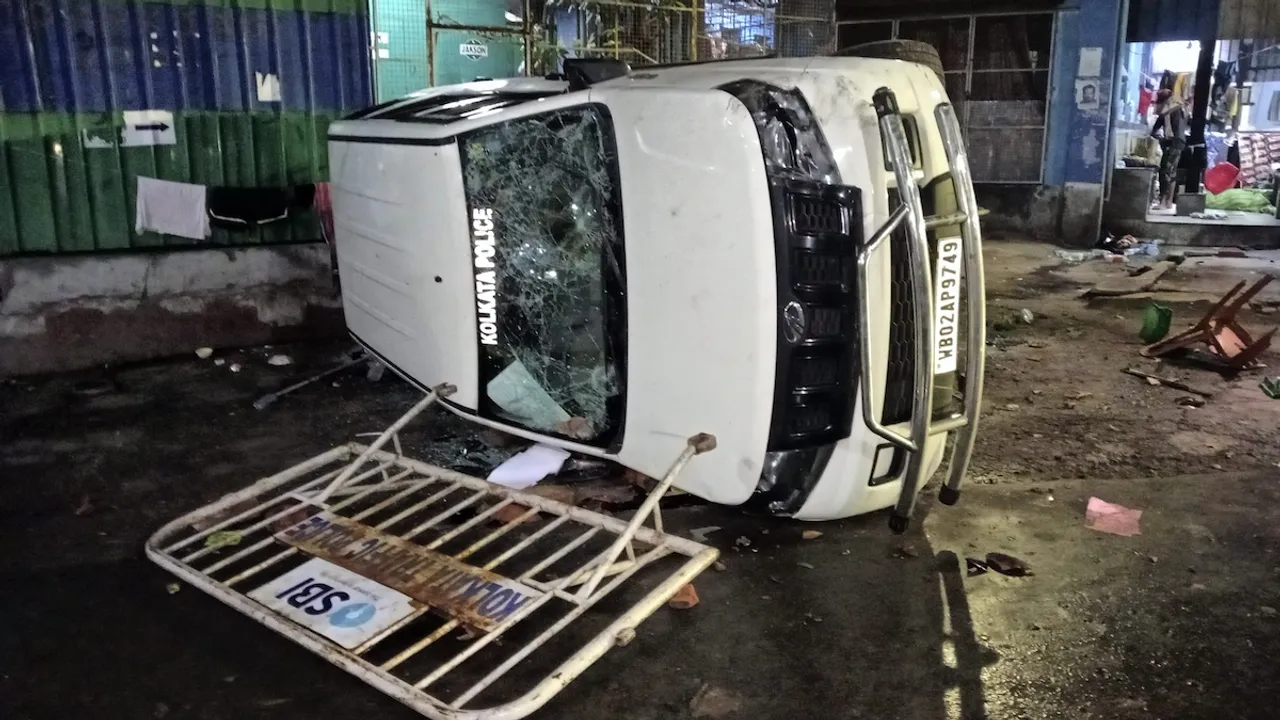 A vandalised Kolkata Police vehicle is seen amid protest at the RG Kar Medical College and Hospital against the alleged rape and murder of a trainee doctor inside the hospital premises, in Kolkata, early Thursday, Aug. 15, 2024.