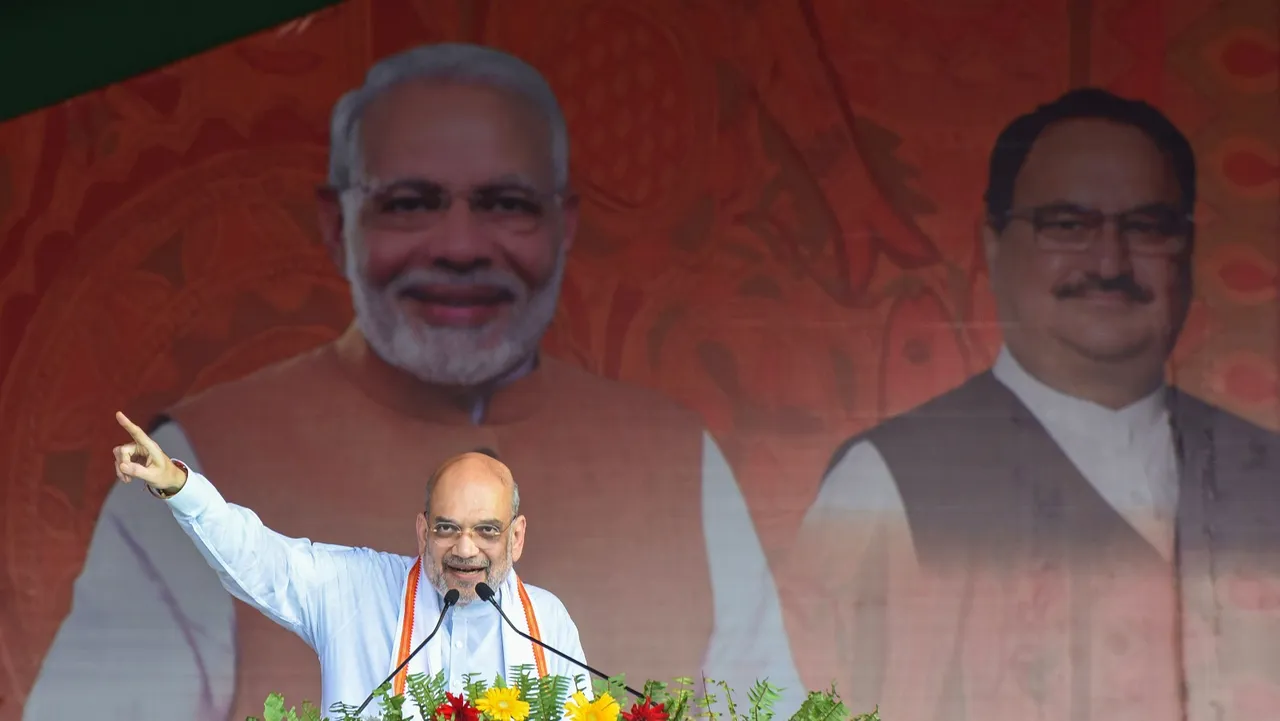 Union Home Minister Amit Shah addresses the crowd during a public meeting at Jhanjharpur, in Madhubani district