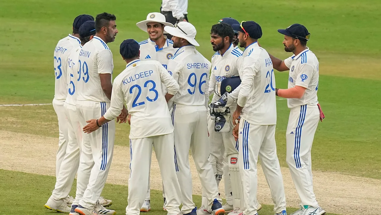 India's bowler Ravichandran Ashwin with teammates celebrates the wicket of England's batter Ben Duckett during the third day of the second Test