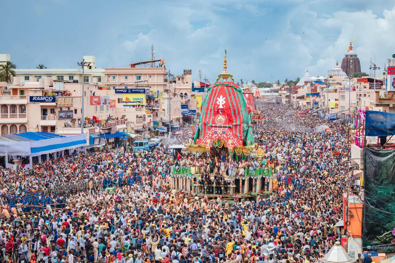 Devotees gather around the chariots of Lord Jagannath at Maushima temple in Puri, Monday, 8 July 2024.