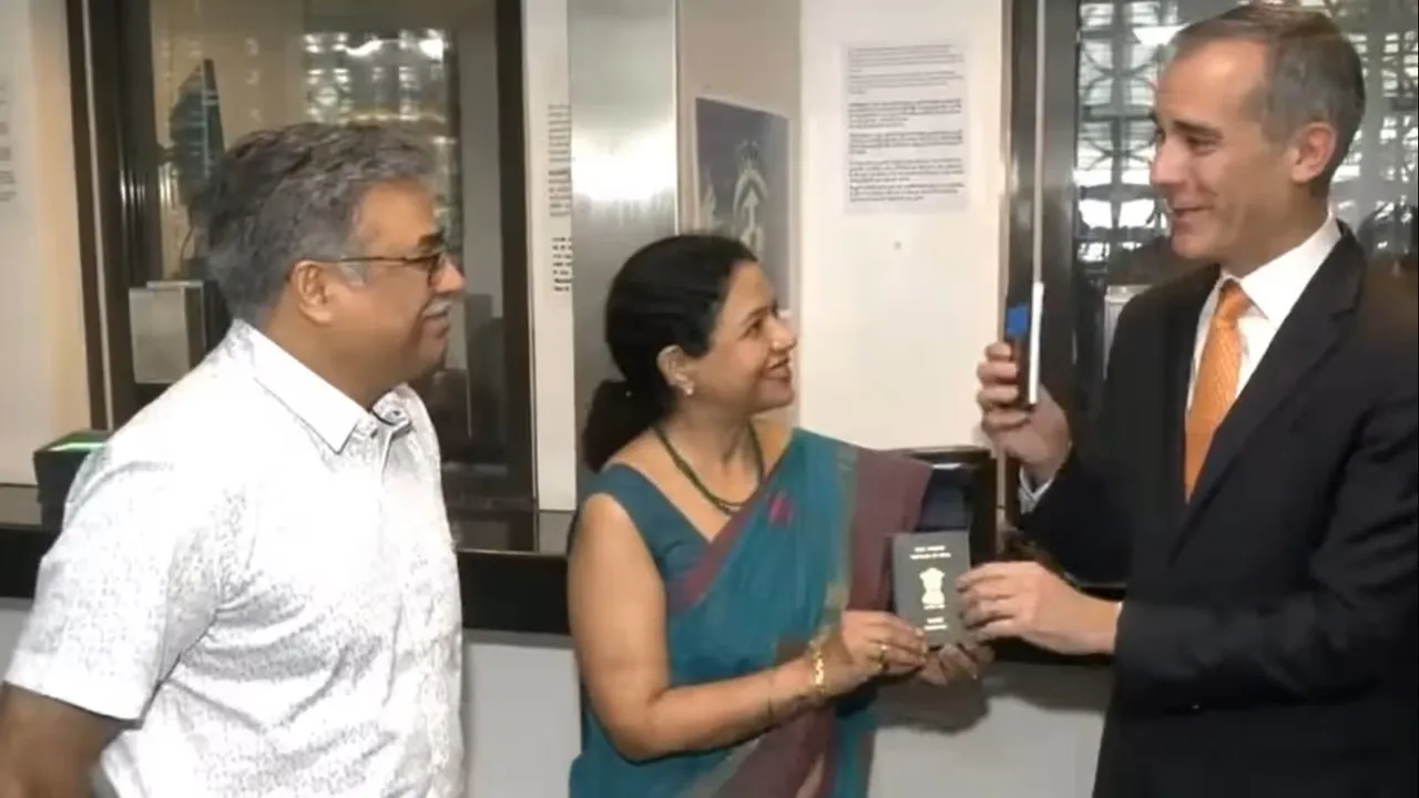 US Ambassador Eric Garcetti hands over one millionth US Visa in Delhi