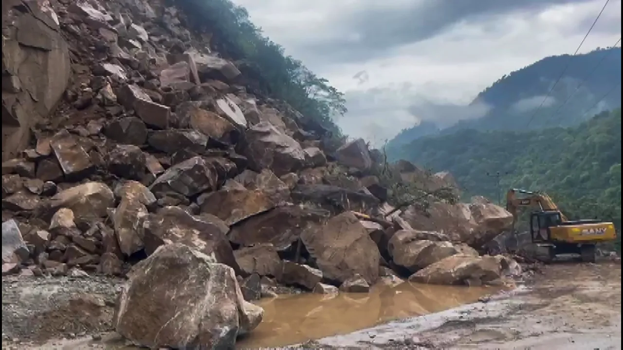 Heavy machinery being used to clear the blocked Chandigarh-Manali highway following a landslide triggered by continuous rain in Himachal Pradesh, in Mandi district