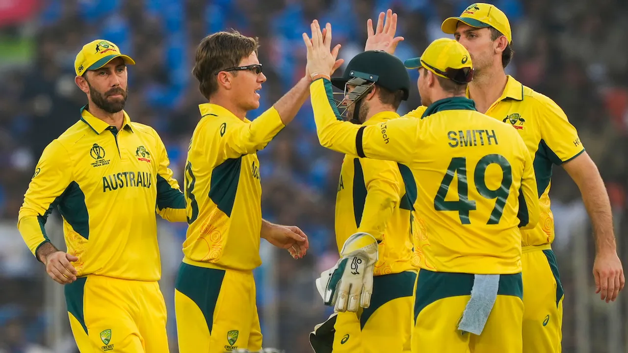 Australia's Adam Zampa with Josh Inglish celebrates the wicket of India's Jasprit Bumrah during the ICC Men’s Cricket World Cup 2023 final match between India and Australia, at the Narendra Modi Stadium, in Ahmedabad, Sunday, Nov. 19, 2023.