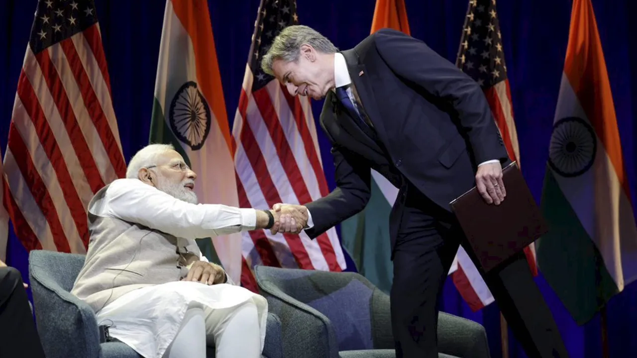 Prime Minister Narendra Modi shakes hand with Secretary of State Antony Blinken during an interactive session with leading professionals across various fields, in Washington, Friday, June 23