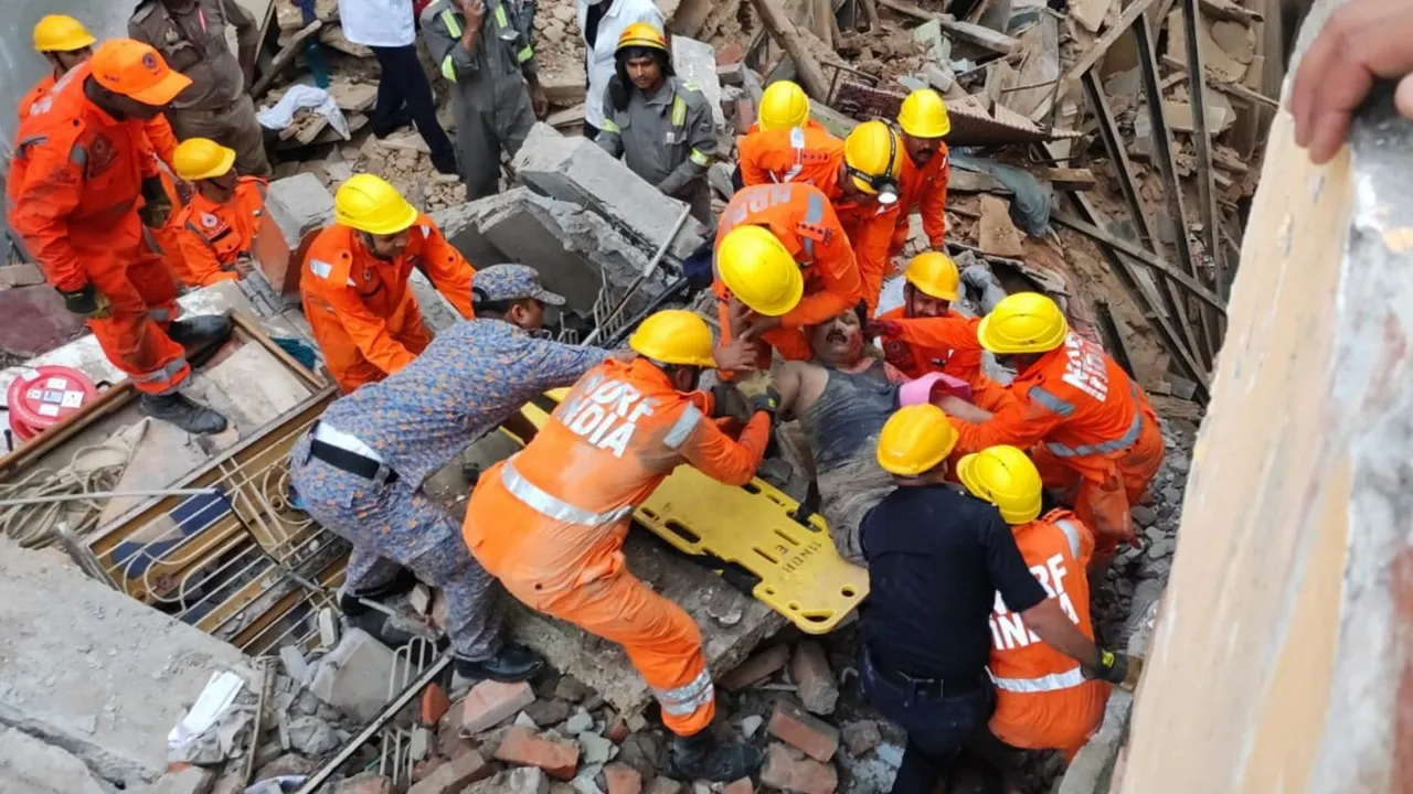 NDRF personnel carry out rescue work after two houses collapsed near the Kashi Vishwanath temple, in Varanasi, Tuesday, Aug. 6, 2024.