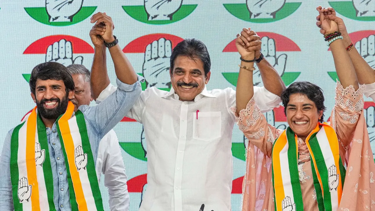 AICC General Secretary KC Venugopal with wrestlers Vinesh Phogat and Bajrang Punia as they joined Congress at the party headquarters, in New Delhi, Friday, Sept. 6, 2024.