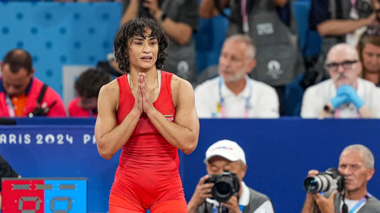 Wrestler Vinesh Phogat celebrates after winning her Women's Freestyle 50kg semi-final wrestling match against Cuba's Yusneylys Guzman Lopez at the 2024 Summer Olympics, in Paris, France, Tuesday, Aug. 6, 2024.