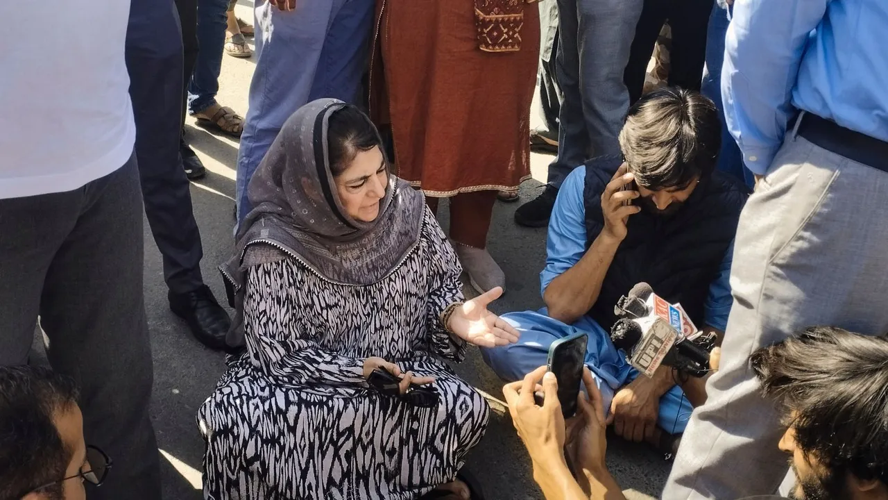 PDP chief Mehbooba Mufti sits on a protest after the alleged detention of her party workers, on the day of voting in the sixth phase of Lok Sabha elections, in Anantnag district, Saturday, May 25, 2024