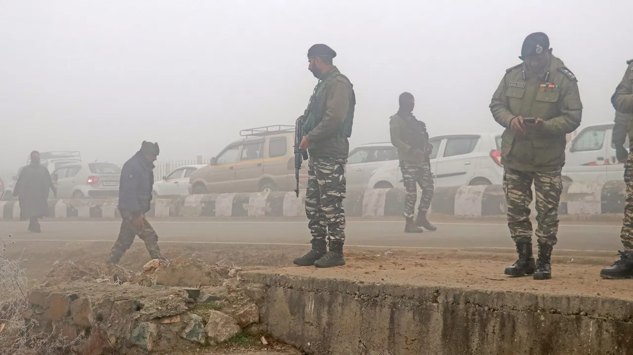Security personnel at a search operation after detecting and defusing an IED put up by militants on Srinagar-Baramulla National Highway