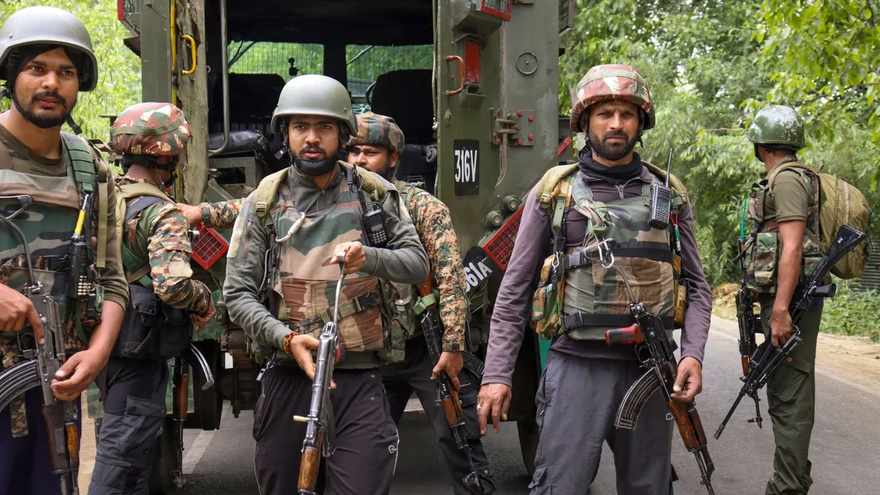 Security personnel stand guard during an encounter with terrorists, in Kulgam, Saturday, July 6, 2024.