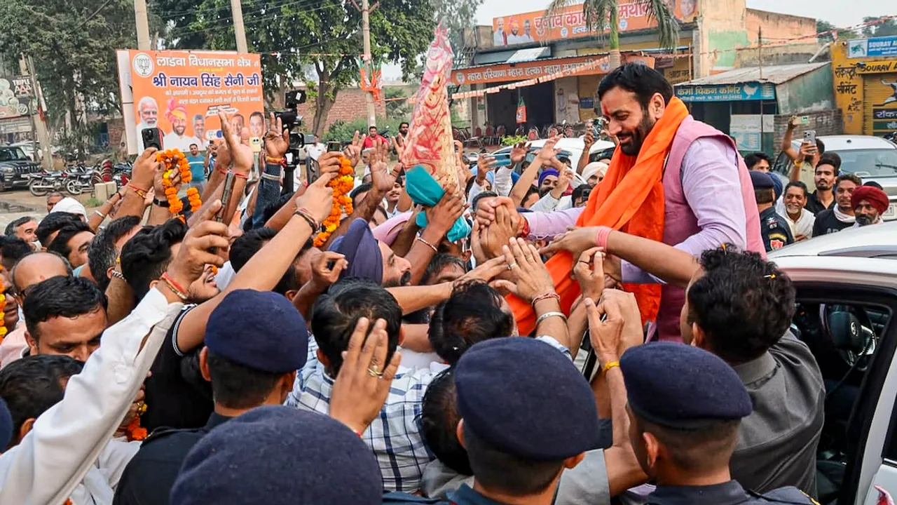 Haryana Chief Minister Nayab Saini greets supporters after winning the Assembly elections from Ladwa constituency, at Ladwa, in Kurukshetra district, Tuesday, Oct. 8, 2024.