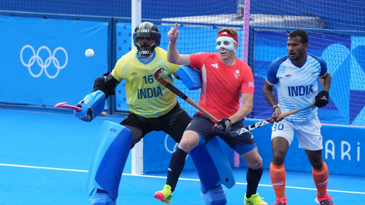 India's goalkeeper PR Sreejesh (16) and Amit Rohidas (30) in action during the Hockey Men's Quarterfinal match between India and Great Britain at the 2024 Summer Olympics, at Yves-du-Manoir Stadium, in Colombes, France, Sunday, Aug. 4, 2024.