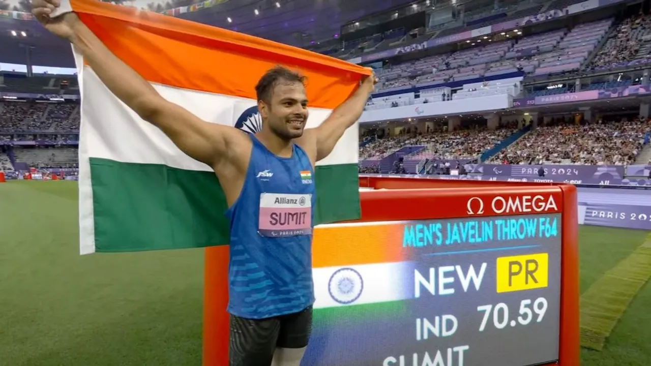 Sumit Antil poses for photographs after winning the gold medal in javelin throw F64 event in Paris Paralympics 2024, Monday, Sept. 3, 2024