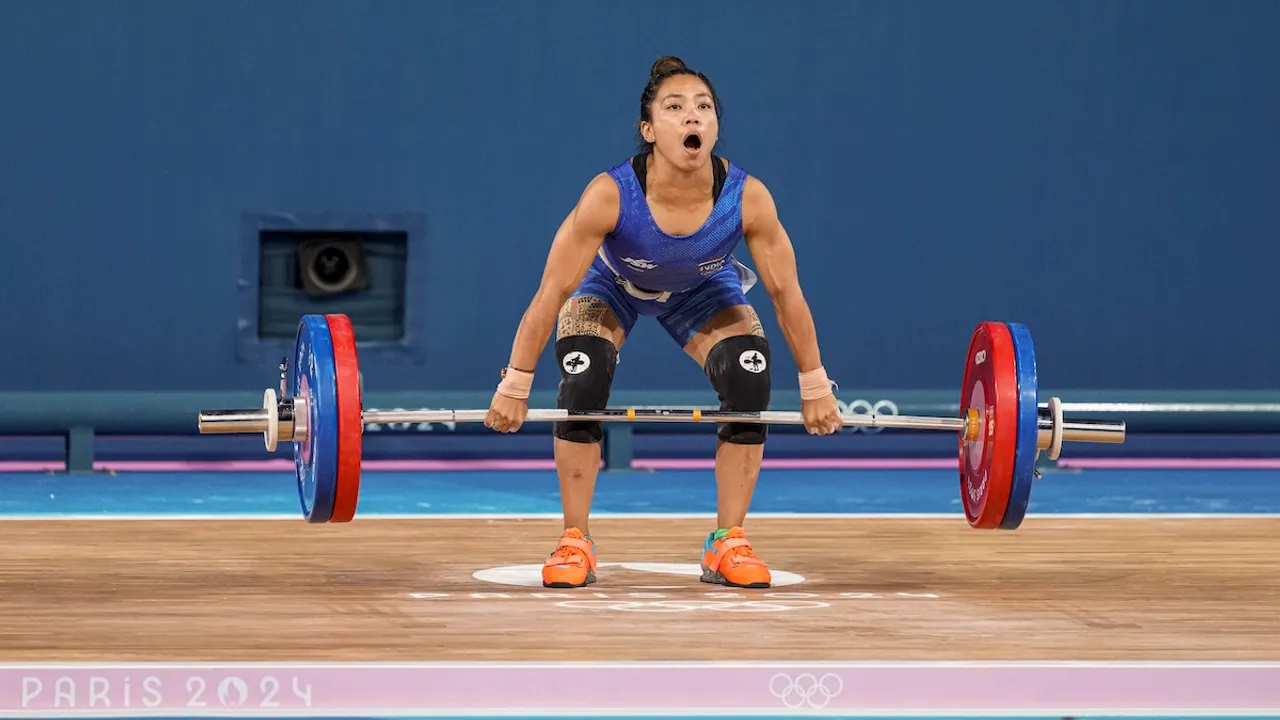 India's Mirabai Chanu after her unsuccessful third attempt during the clean and jerk stage of the women's 49kg weightlifting event at the 2024 Summer Olympics, in Paris, France, Wednesday, Aug. 7, 2024.
