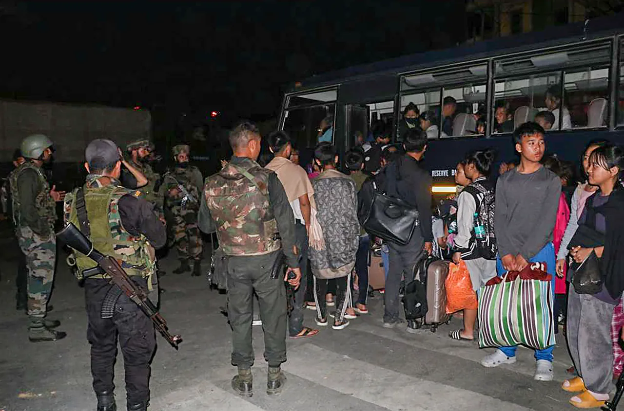 Indian Army and Assam Rifles personnel rescue civilians from violence-hit areas, in Manipur