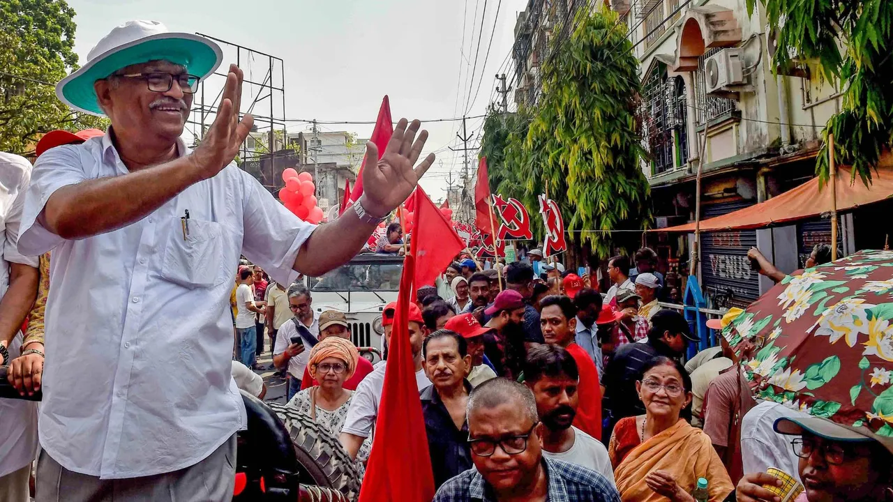 CPI(M) supporters during a road show of party candidate Sujan Chakraborty for Lok Sabha elections, in Kolkata, Sunday, April 28, 2024.