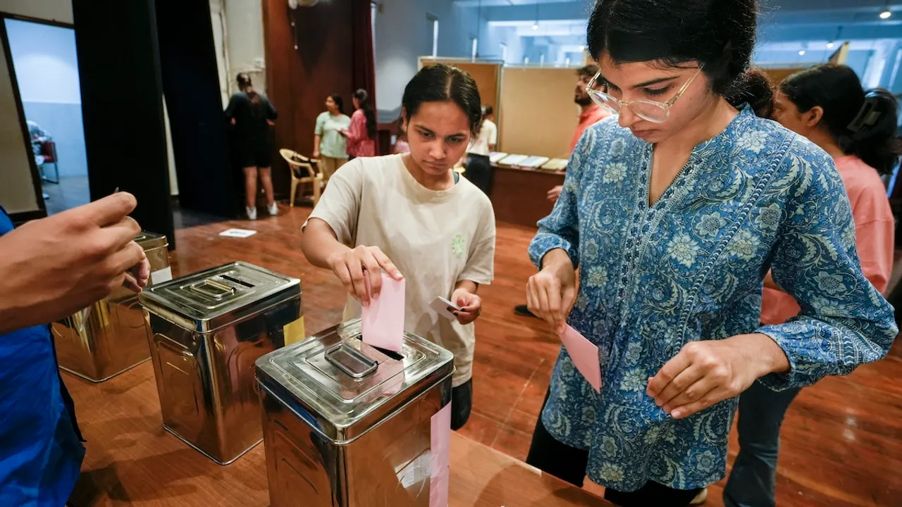 Students cast their votes during the Delhi University Students' Union (DUSU) polls 2024, at Miranda House college, in New Delhi, Friday, Sept 27, 2024. 