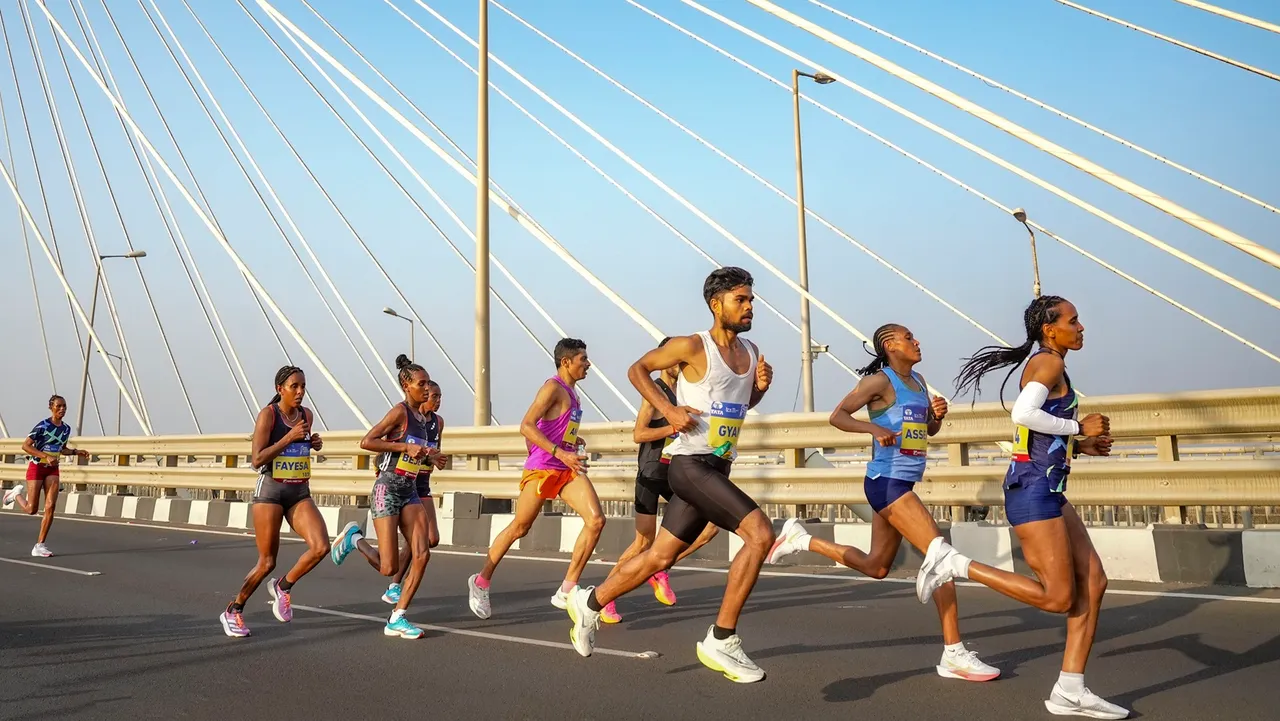 Participants run during the Mumbai Marathon 2024, at Bandra-Worli Sea Link, in Mumbai