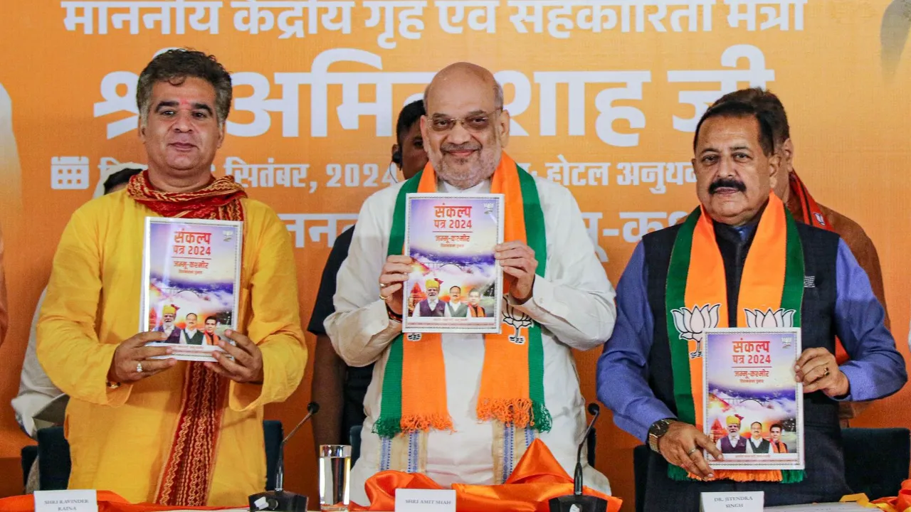 Union Home Minister Amit Shah with Jammu and Kashmir BJP President Ravinder Raina and Union Minister Jitendra Singh release the party's election manifesto, in Jammu, Friday, Sept. 6, 2024.