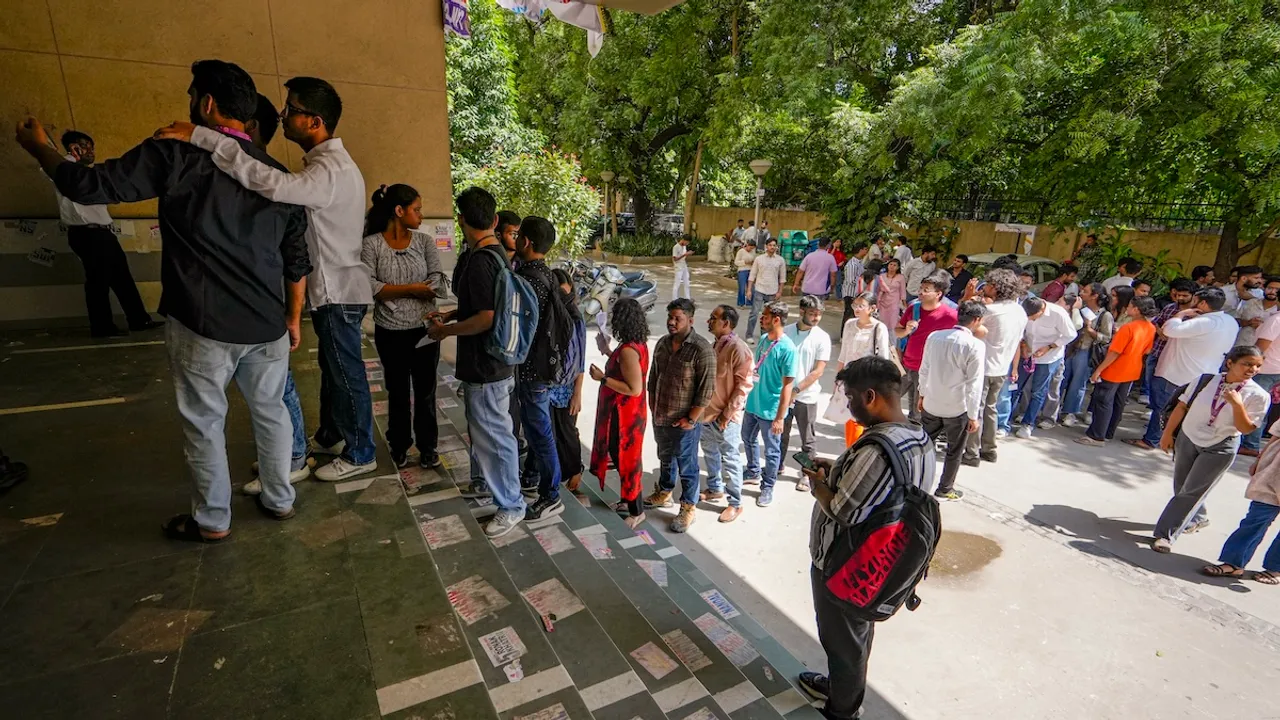 Students stand in a queue at a polling booth to cast their votes during the Delhi University Students' Union (DUSU) polls 2024, at Campus Law Centre, in New Delhi, Friday, Sept 27, 2024.