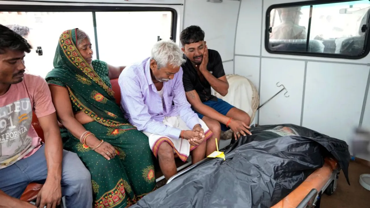 Family members of 37-year-old Ruby, victim of a stampede, mourn after receiving her body from a mortuary as they prepare to leave for their hometown, outside Hathras district hospital, Uttar Pradesh, India, Wednesday, July 3, 2024