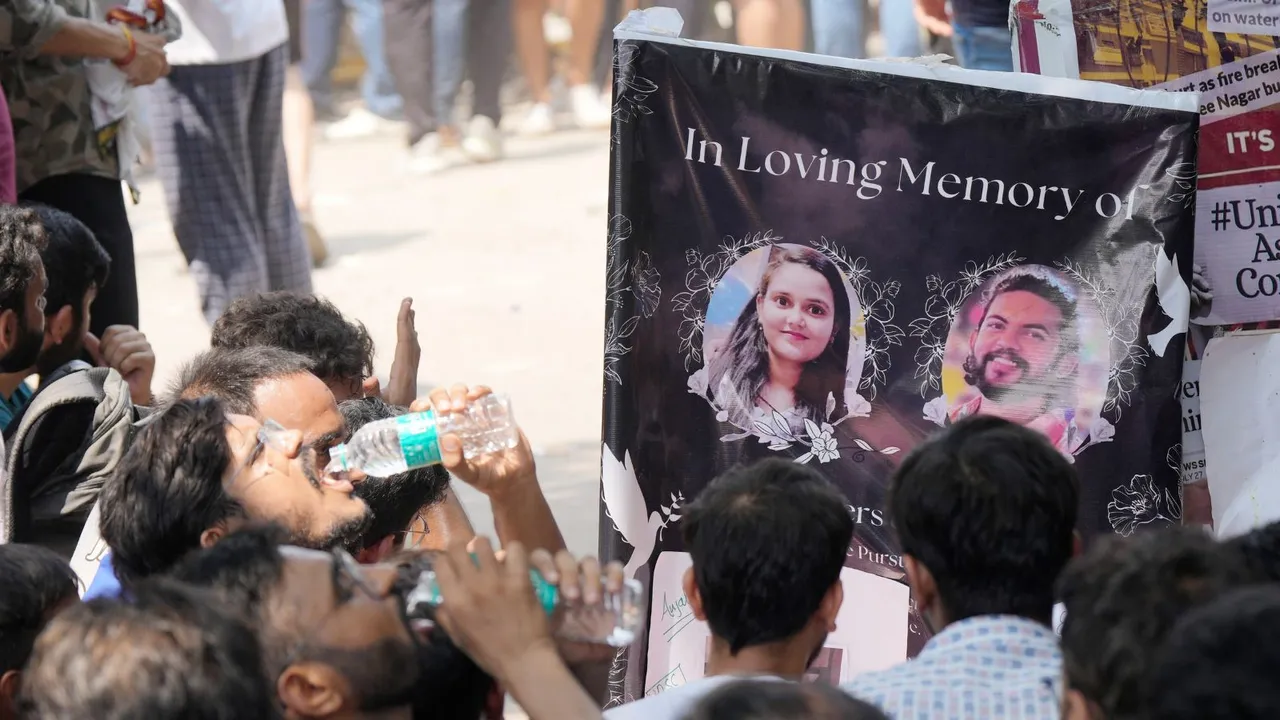 Students stage a protest after three civil services aspirants died due to drowning at a coaching centre in Old Rajinder Nagar area, in New Delhi