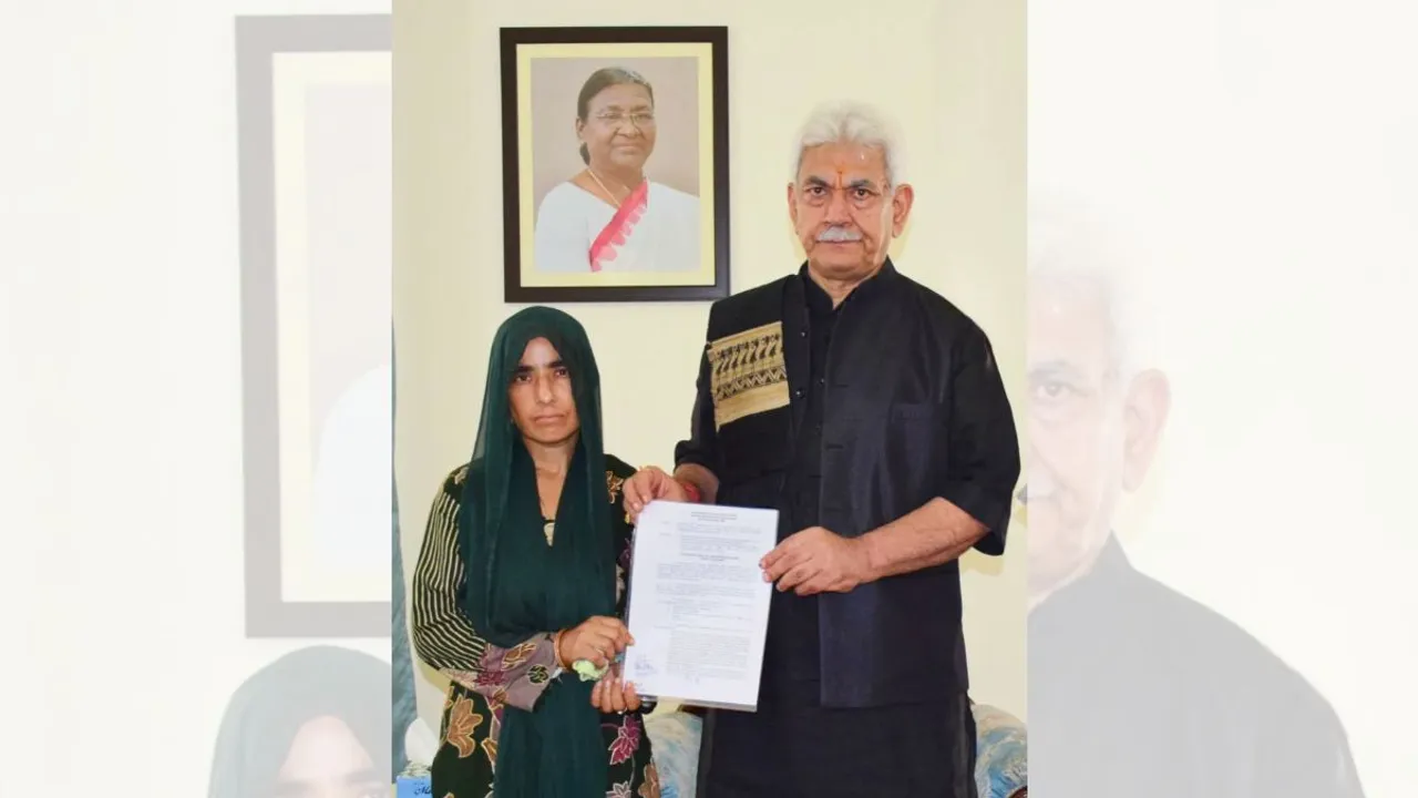 J&K LG Manoj Sinha handed over the appointment letter to the wife of a bus driver who was among nine persons killed in a terror attack on Saturday