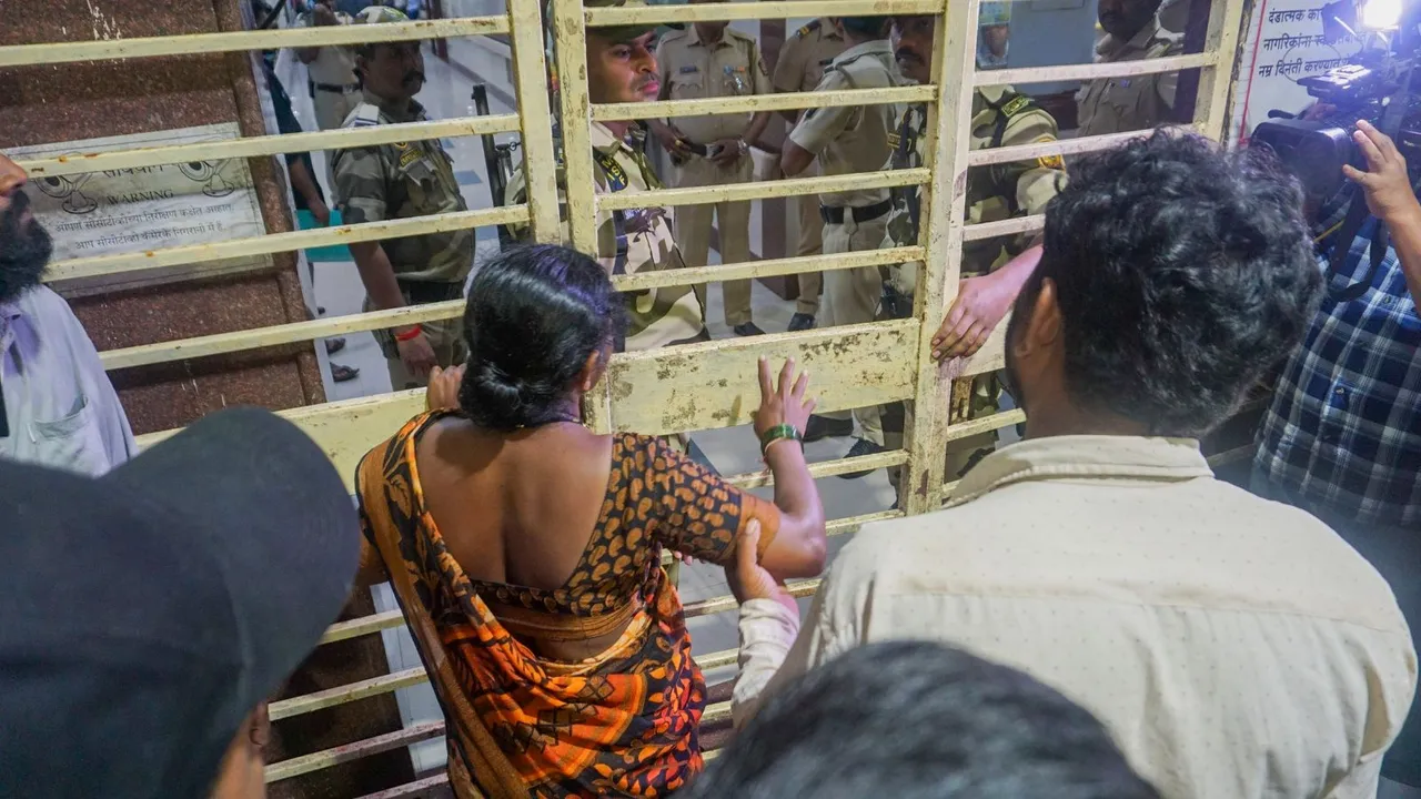 Parents of Akshay Shinde, the accused in the Badlapur sexual assault case of two minor girls, outside the Kalwa Hospital where his body was brought after the police encounter, in Thane, late Monday night, Sept. 23, 2024.