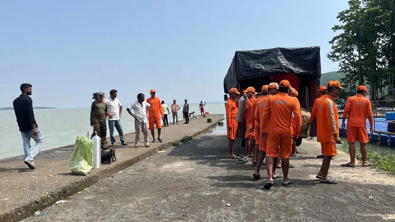 NDRF personnel preparing for a search operation in the lake
