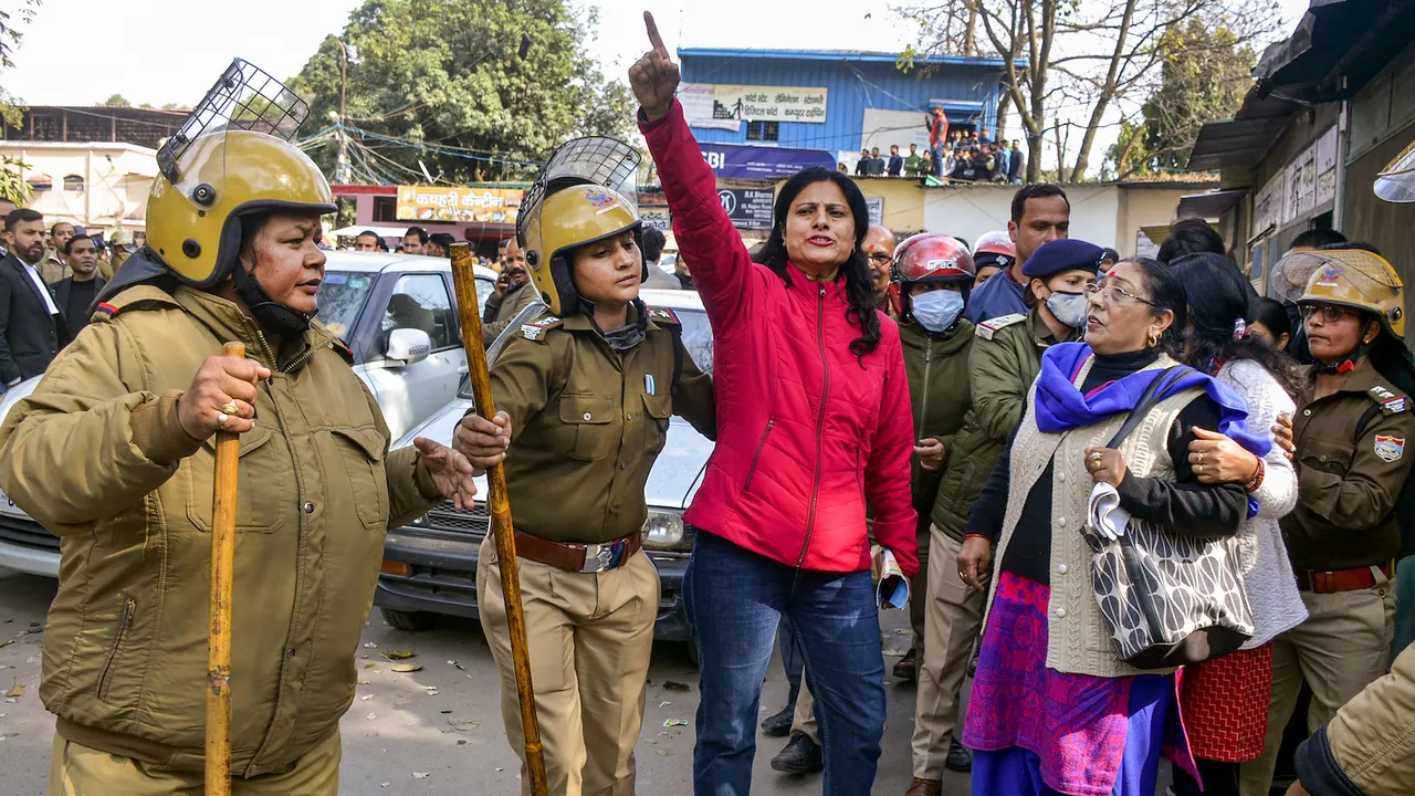 A protestor raises slogans at Shaheed Smarak in district court premises against police action during Thursday's protest over alleged irregularities in state government recruitment examinations in Dehradun on Friday