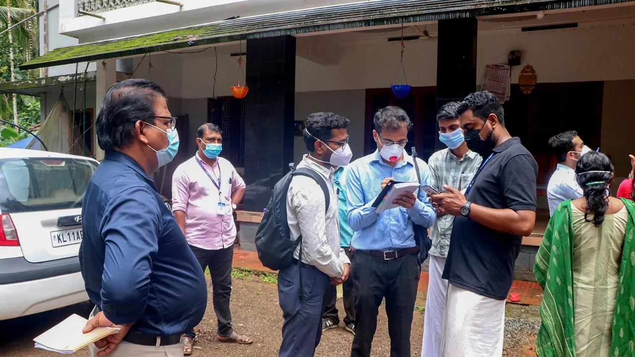 Health workers collect clinical samples and investigate the home of a Nipah virus victim, in Kozhikode
