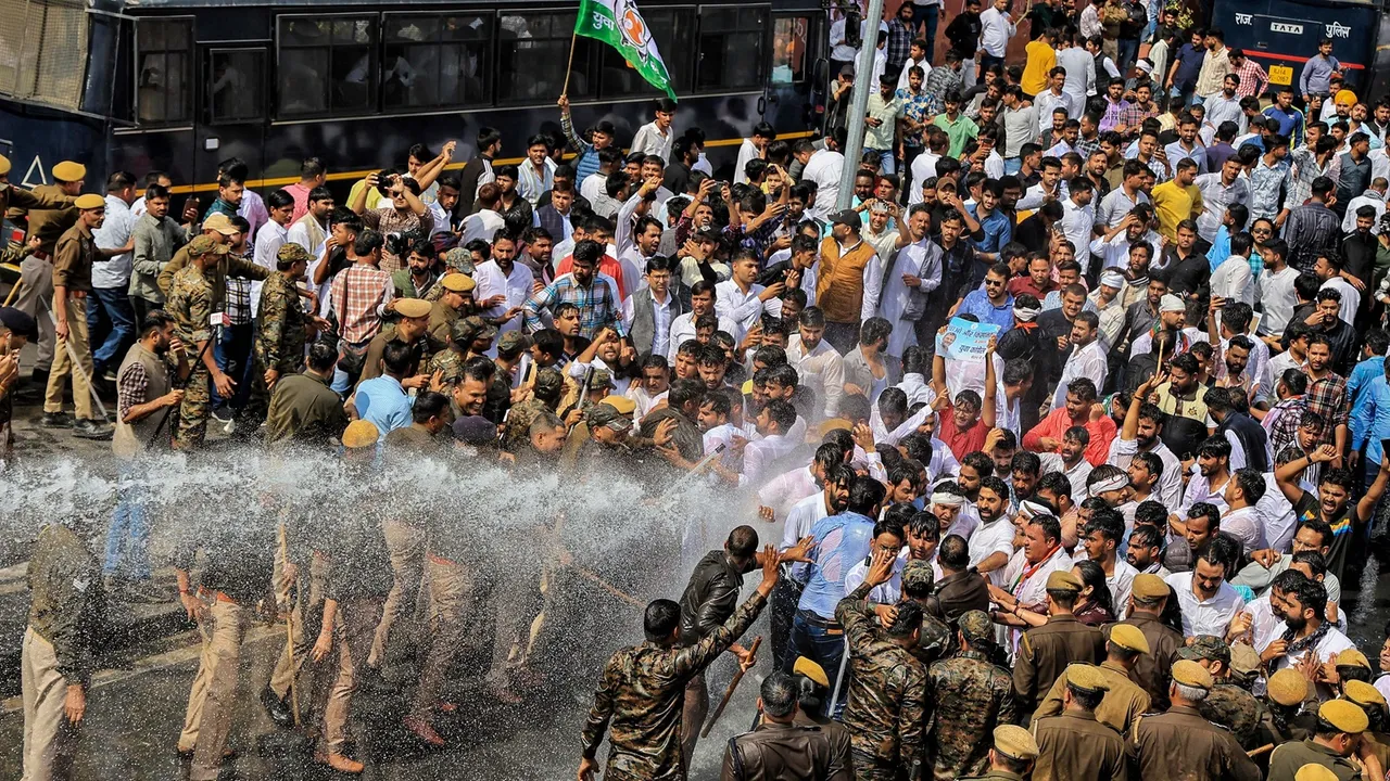 Police use water cannon to disperse Indian Youth Congress workers protesting in support of farmers, in Jaipur
