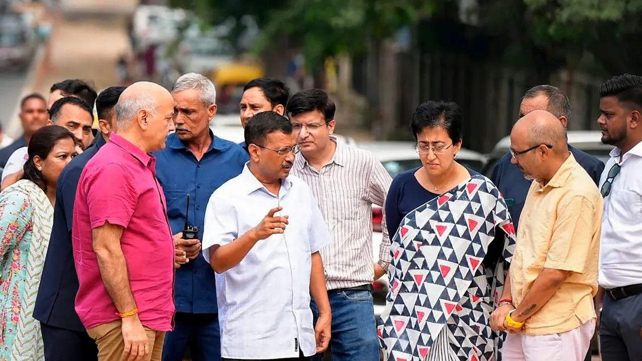 Delhi Chief Minister Atishi with former chief minister Arvind Kejriwal and former deputy chief minister Manish Sisodia inspects roadwork in the Delhi University area, in New Delhi, Thursday, Sept. 26, 2024.