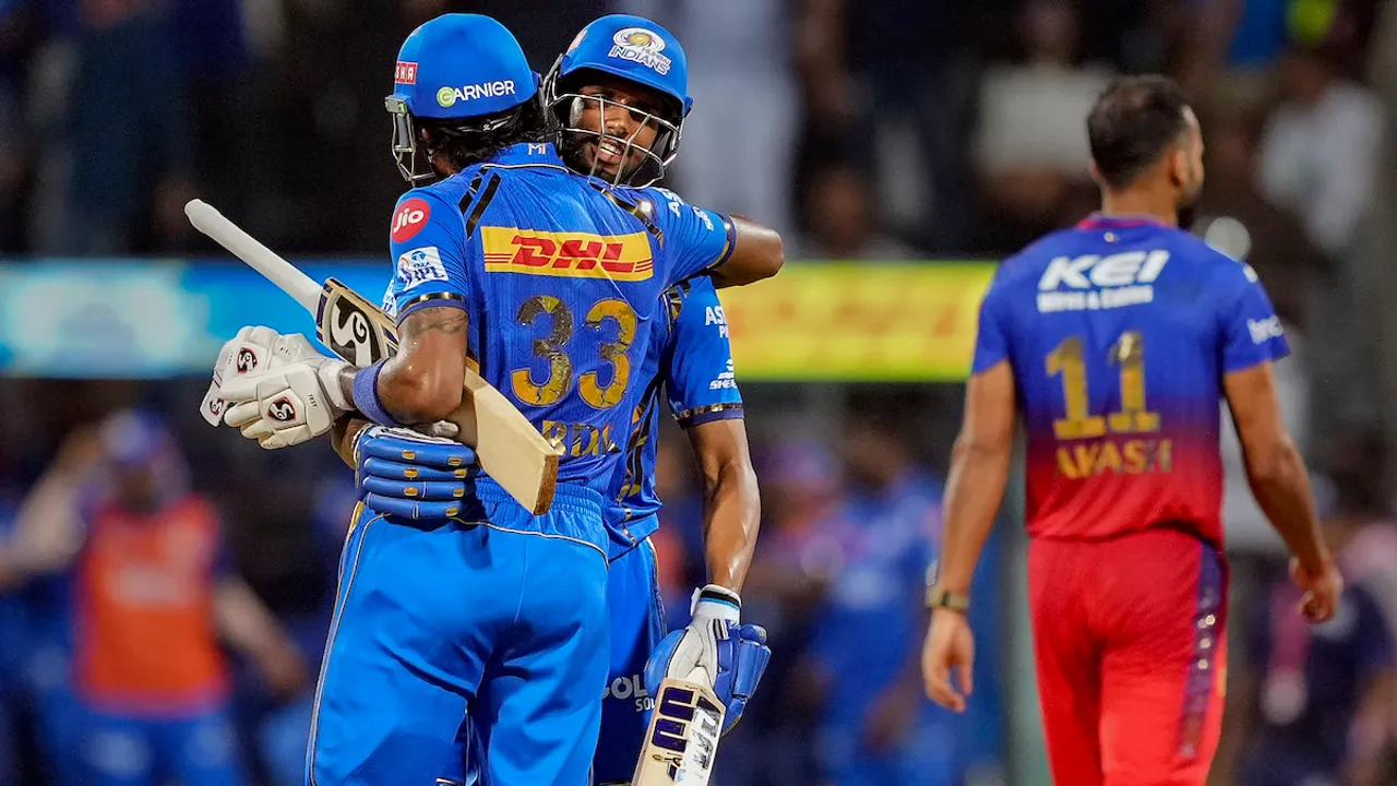 Mumbai Indians captain Hardik Pandya and Tilak Verma celebrate their win after the IPL 2024 cricket match against Royal Challengers Bengaluru and Mumbai Indians at Wankhede Stadium, in Mumbai, Thursday, April 11, 2024.