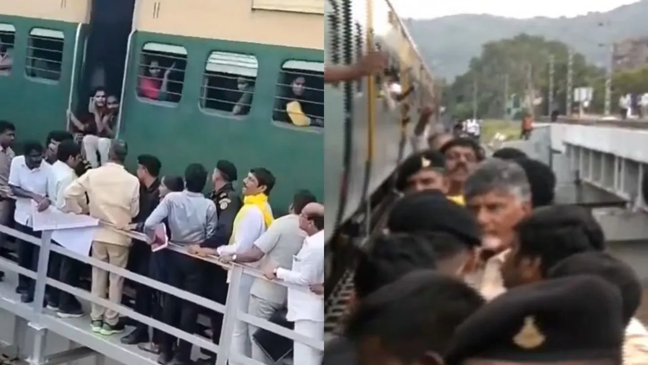 Andhra Pradesh Chief Minister N Chandrababu Naidu stands on a bridge even as a train passes near him during flood inspection, in Vijayawada, Thursday, Sept. 5, 2024.