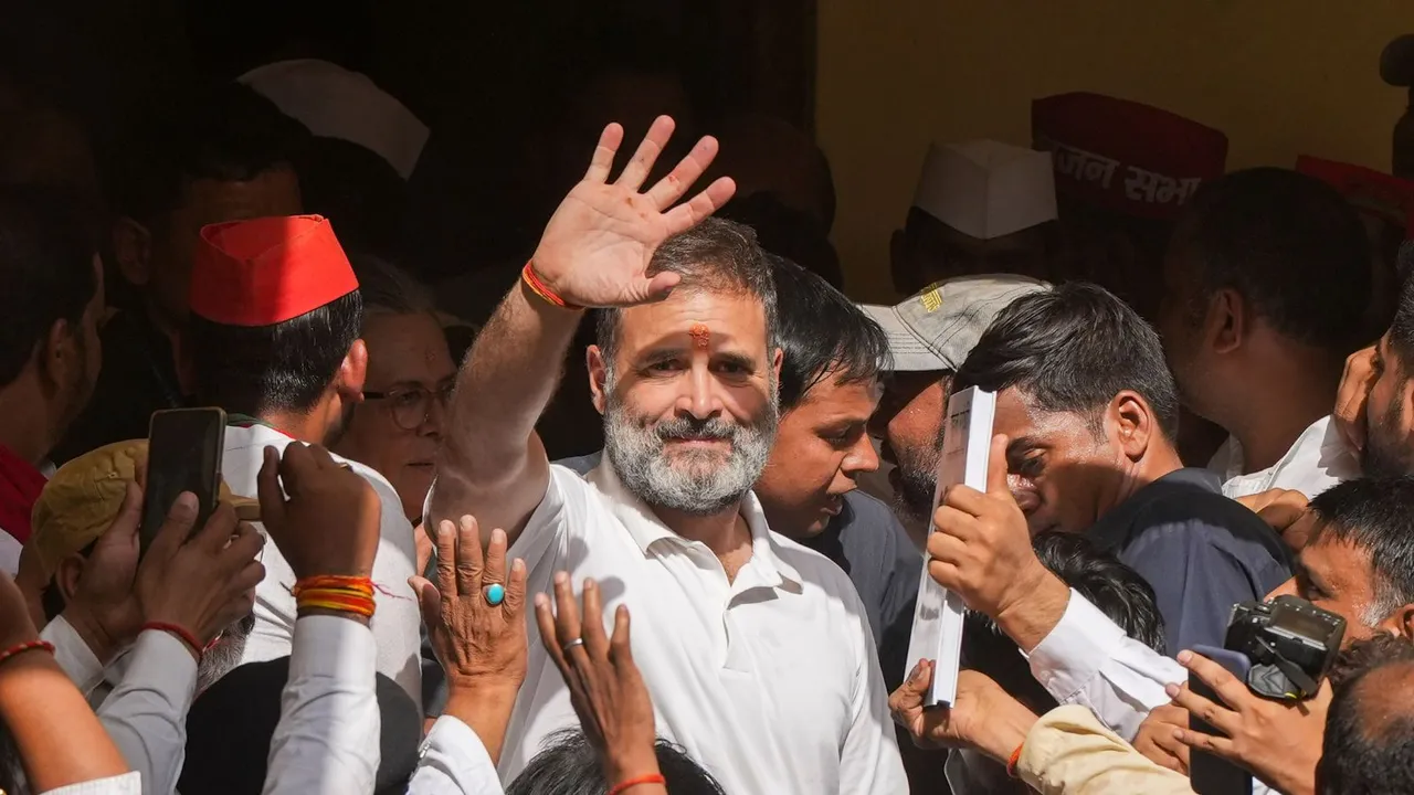 Congress leader and candidate from Rae Bareli constituency Rahul Gandhi waves to supporters after performing havan for the Lok Sabha elections, in Rae Bareli, Friday, May 3, 2024