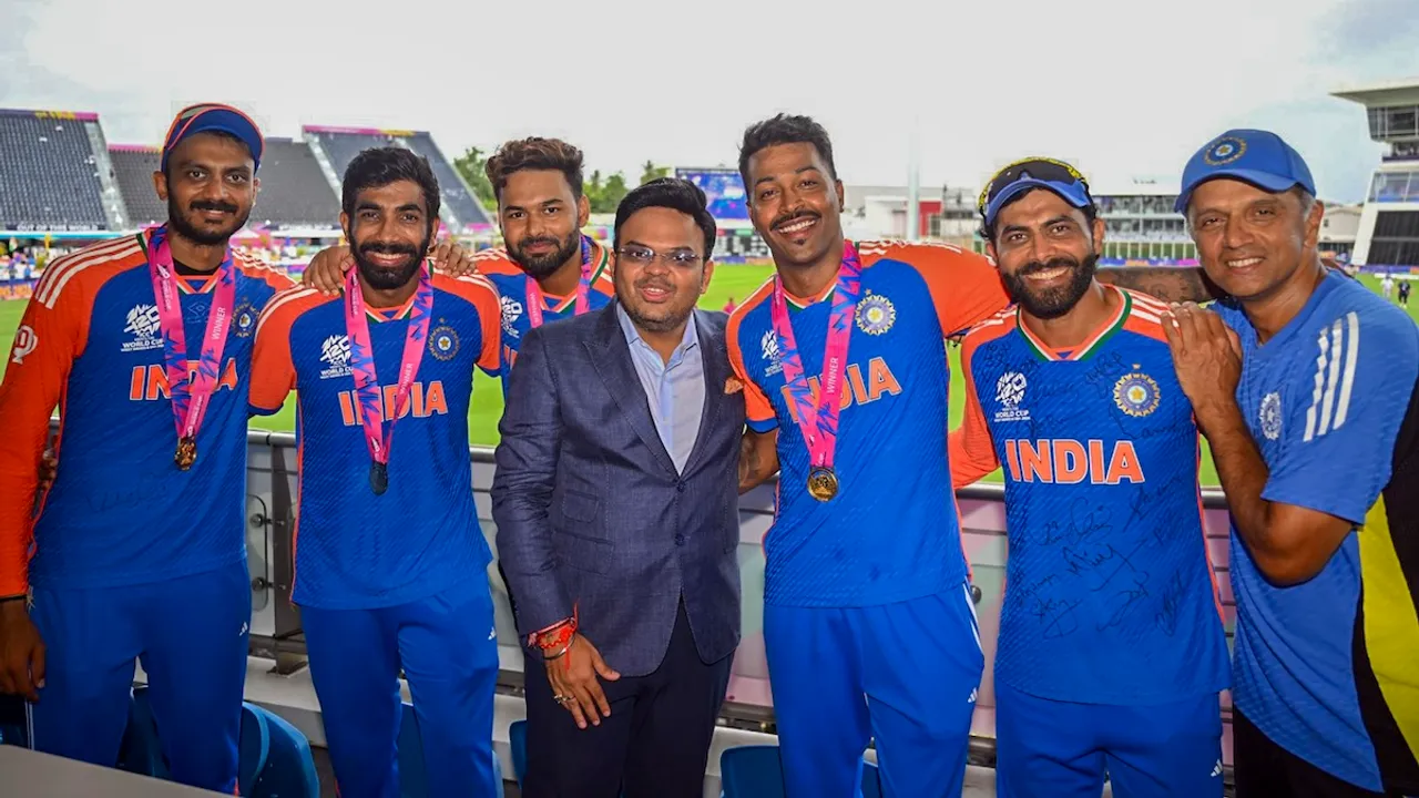 India's Head Coach Rahul Dravid and team captain Rohit Sharma with players Axar Patel, Jasprit Bumrah, Rishabh Pant, Hardik Pandya and Ravindra Jadeja and BCCI Secretary Jay Shah during celebration after India defeated South Africa in the ICC Men's T20 World Cup final cricket match, at Kensington Oval, in Bridgetown, Barbados, Sunday, June 30, 2024.