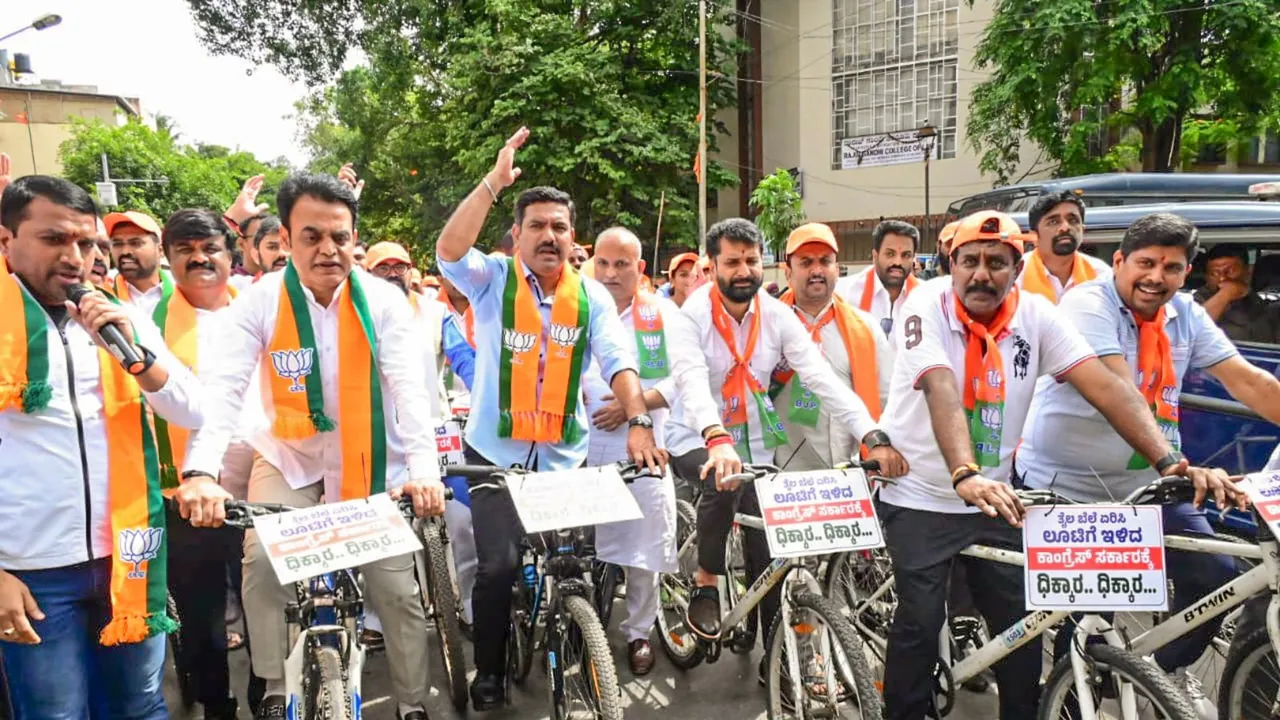BJP Karnataka President B Y Vijayendra along with other party workers and leaders during a protest against the state government over alleged fuel price hike, in Bengaluru, Thursday, June 20, 2024.
