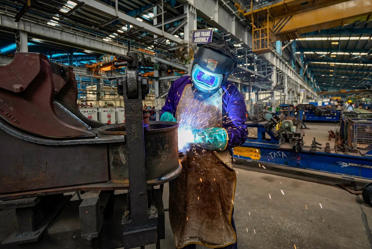 A worker at the manufacturing facility of the Integral Coach Factory (ICF) where Vande Bharat trains are made, in Chennai