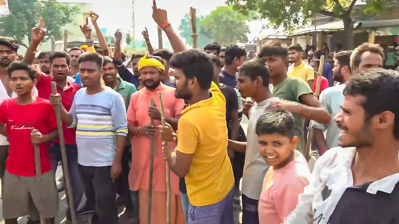People block a road following Sunday night violence during goddess Durga idol immersion, in Bahraich, Monday, Oct. 14, 2024.