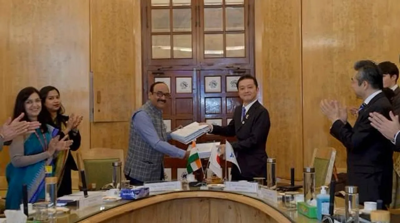 Vikas Sheel and Suzuki Hiroshi strike a happy pose after signing the deal
