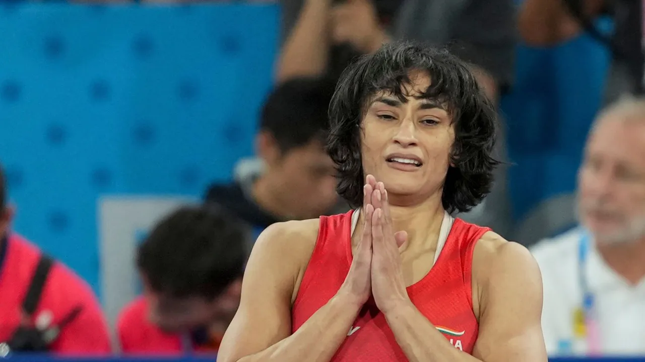 Wrestler Vinesh Phogat celebrates after winning her Women's Freestyle 50kg semi-final wrestling match against Cuba's Yusneylys Guzman Lopez at the 2024 Summer Olympics, in Paris, France, Tuesday, Aug. 6, 2024.