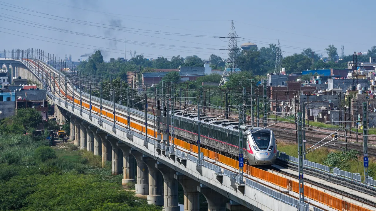 A RAPIDX train runs on its tracks during a media preview ahead of the inauguration of a priority section of the Delhi-Meerut Regional Rapid Transit System (RRTS), in Ghaziabad