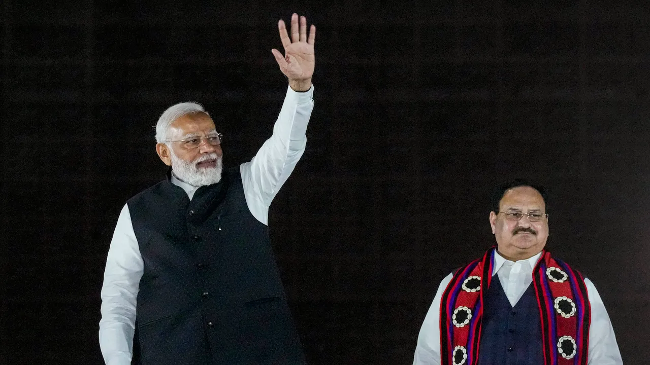 Prime Minister Narendra Modi and JP Nadda at a victory rally at BJP headquarters in New Delhi on Thursday