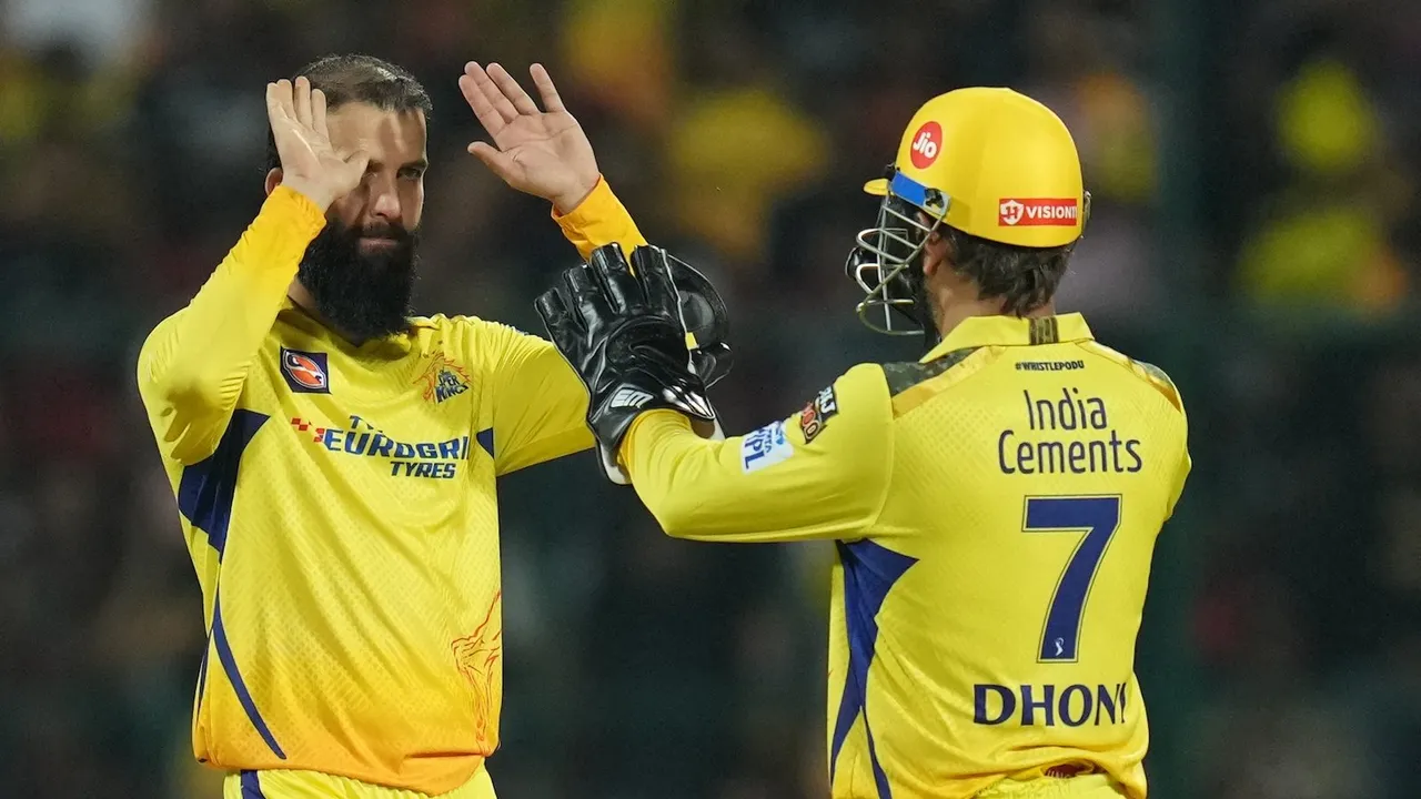 Moeen Ali celebrates with team captain MS Dhoni after the wicket of Royal Challengers Bangalore batter Faf du Plessis at M Chinnaswamy Stadium in Bengaluru on April 17